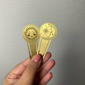 gold metal celestial sun and moon bookmark pair